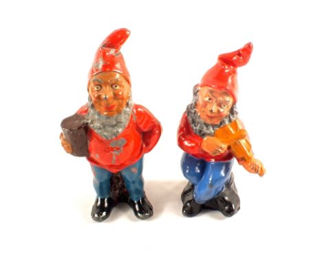 Two Britains large scale lead gnomes, one seated playing the violin and the other with flower pot