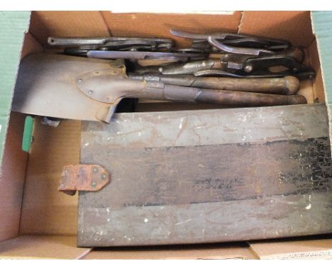 A WWI French Hoskis ammo tin with three WWI German entrenching tools and four pairs of wire cutters