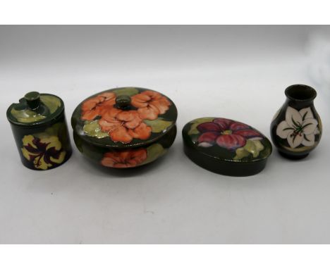Moorcroft Pottery: a collection of items to include a Magnolia ginger jar, a Violet sugar bowl, a Hibiscus candy box, a Bermu