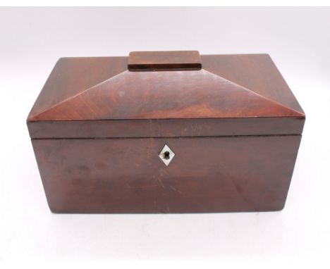 A sarcophagus shaped veneered mahogany tea caddy, mother of pearl escutcheon, with three separate compartments within, bone h