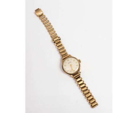 A ladies vintage Buren Grand Prix 9ct gold wristwatch, comprising a round signed silvered dial with applied gilt Arabic indic