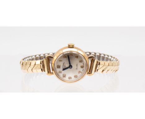 A ladies vintage 9ct gold Rotary wristwatch, comprising a round signed silvered dial with applied gilt Arabic indices, blue s