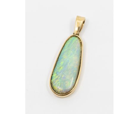 An opal and 9ct gold pendant, comprising a pear shaped elongated white opal, approx 26 x 10mm, green and orange play of colou