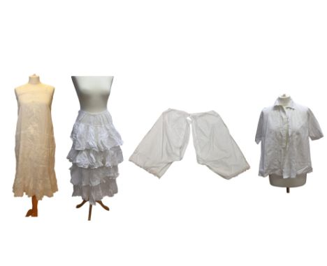 A pair of mid to late Edwardian pantaloons, a late Edwardian cotton white slip, the broderie anglaise pin tucks are from the 
