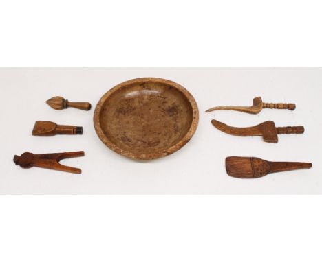 A small collection of 19th/early 20th century treen items comprising; a circular turned wooden bowl, a pair of nutcrackers, l