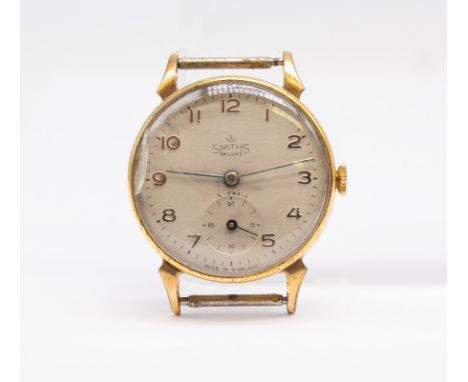 A gents gold plated  vintage 'Smiths' Deluxe wristwatch face,  compriisng a silkvered dial with applied gilt Arabic indices, 