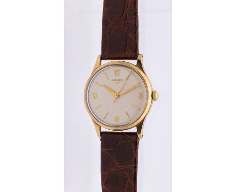 Longines- a gentleman's 9ct gold vintage wristwatch, comprising a silvered round dial with applied gilt quarter Arabic number