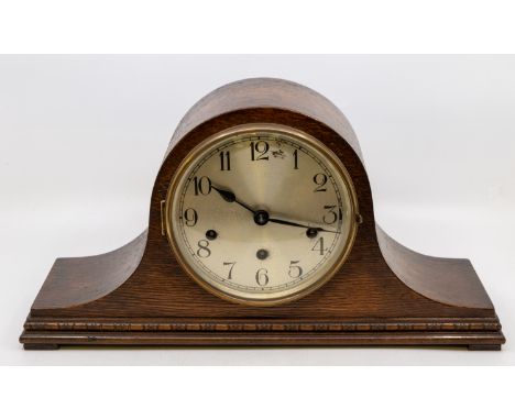 A 1930s oak Napoleon mantle 8 day mantle clock with Westminster chime.