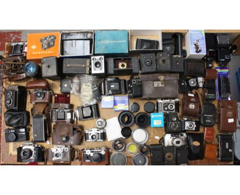 Cameras: A large collection of assorted modern and vintage cameras to include: Kodak, Pentax, Argus, Exakta, Rollei, Rolleico