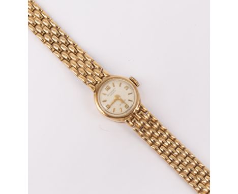 A ladies vintage 9ct gold Rotary wristwatch comprising a round signed silvered dial with applied gilt quarter Arabic and bato