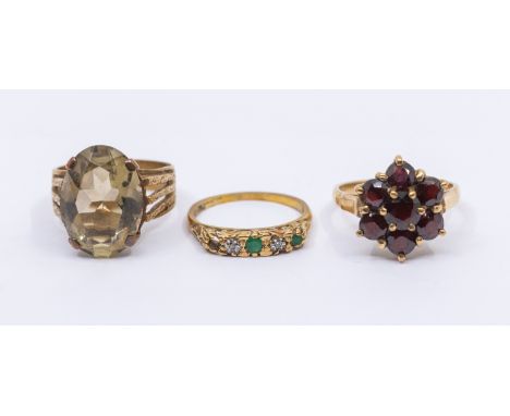 A collection of three gold stone set rings, comprising a garnet flower cluster, diameter approx 13mm, size P, along with a la