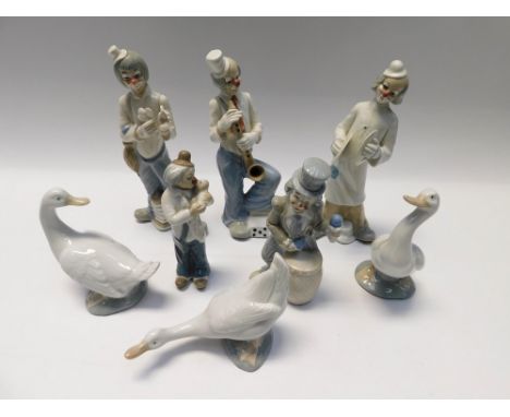 A collection of Tengre clown figures along with a Nao geese.(8)