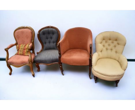 A late 19th century parlour chair, on brass casters with pink upholstery, a single cream upholstered easy chair on casters, a