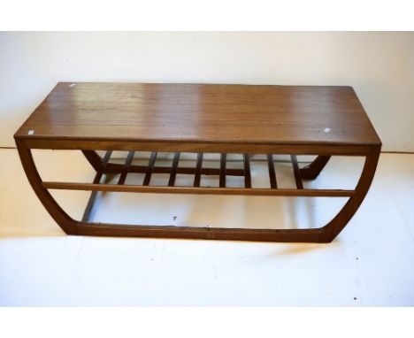 A teak 1970's coffee table with rack effect shelf underneath. date stamp for December 1971