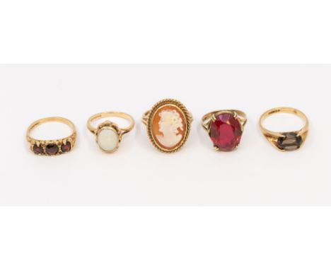 A collection of various 9ct gold stone set rings to include a cameo ring, width approx 22mm, size P, an opal oval set ring, s