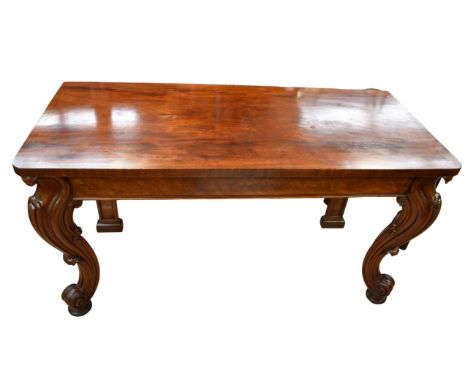 A mid 19th Century mahogany console table, rectangular top above burr mahogany frieze, cabriole supports with carved aprons o