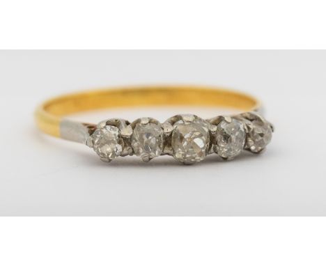 A diamond and 18ct ring, comprising five graduated old European cut diamonds, claw set in platinum to a yellow gold mount, wi