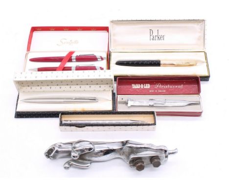 A collection of boxed vintage fountain and ball point boxed pens along with chrome Jaguar car bonnet figure.