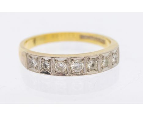 A diamond set 18ct gold half eternity ring, comprising a row of seven small diamonds, platinum set, width approx 4mm, Q, tota