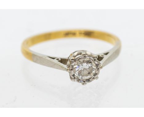 A diamond and 18ct gold solitaire ring, comprising a platinum illusion set round brilliant cut diamond approx 0.25ct, platinu