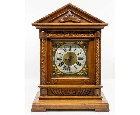 A Junghans large oak cased 19th/early 20th century bracket clock, with door opening to reverse to show movement with Junghans