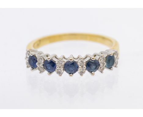 A sapphire and diamond 18ct gold half eternity ring, comprising a row of five round mixed cut sapphires, each approx 2mm and 