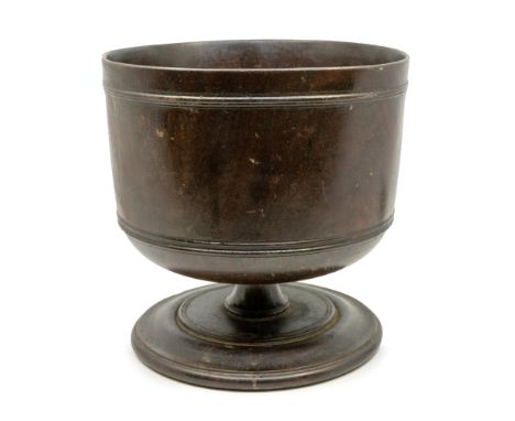 A Charles II Lignum Vitae Wassail bowl, circa 1685, with ring decoration on squat waisted stem above step base, approx. 23cm 