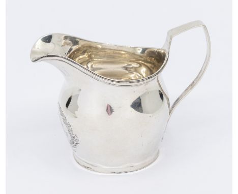 A George III silver helmet shaped cream jug, engraved with initials within foliage/wreath, London, 1816, makers mark rubbed, 