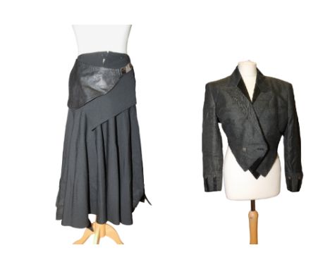 A Japanese black skirt in wool with a leather skirt by Kansai with draped front wide leather band from waistline and a Kansai