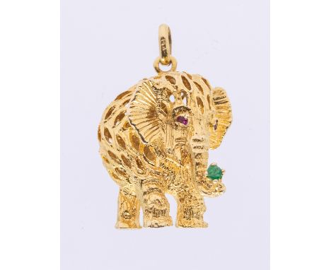 A 14ct gold ruby and emerald set pendant, modeled as an elephant, the eyes set with rubies and the trunk with a single emeral