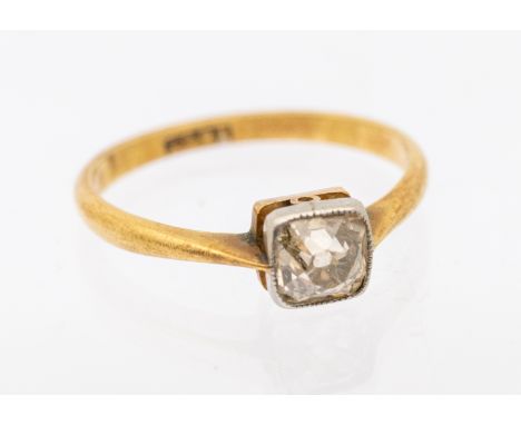 A diamond 18ct gold solitaire ring, comprising an old cushion cut diamond approx 0.40ct, rub over set with milled border, tap