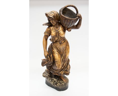 A large terracotta figure of a young lady with a wicker basket on her shoulder. Signed 'Goldscheider' and signed by Haviro.  
