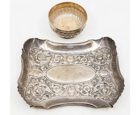 A late Victorian silver dish/tray, having embossed floral and foliage design, large oval vacant cartouche to centre and four 
