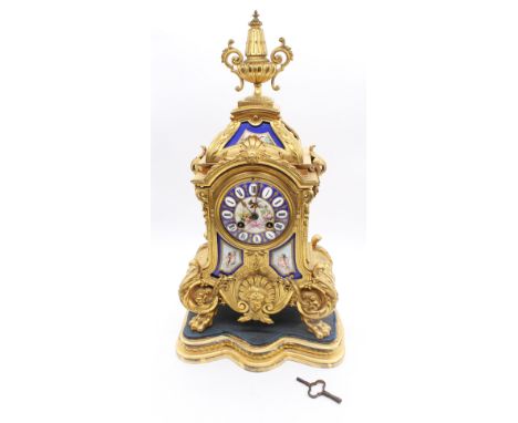 A 19th century mantle clock in the Louis XV style, gilt metal with French Sevres style porcelain panels depicting Cherubs, fo