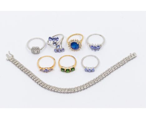 A collection of six Gemporia stone set 9ct gold rings to include a yellow gold mounted three stone tanzanite ring set with pe