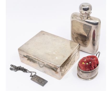 A collection of silver items to include; a George V silver small hip flask, of plain form, crest to front and hinged top, hal