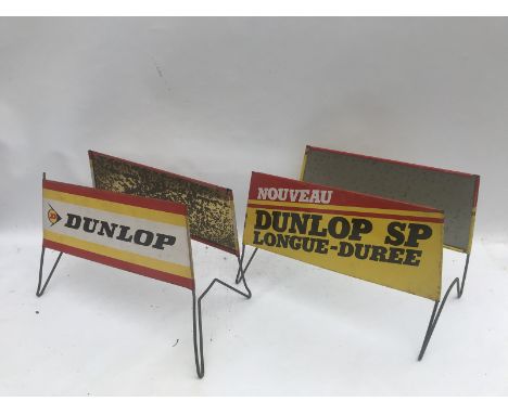 Two Dunlop forecourt tyre advertising stands.