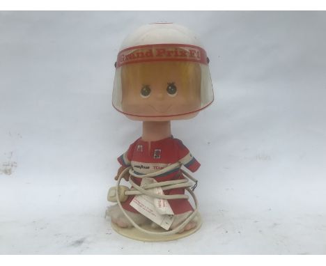 An Elf Grand Prix advertising figure, forming a lamp.