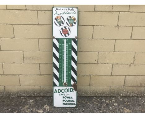 A Duckham's Adcoids Black and White enamel thermometer lacking tube, 11 x 45 1/2".