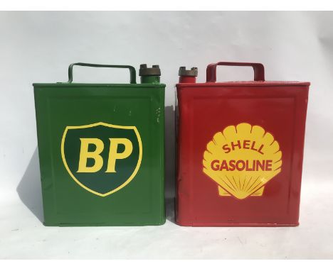 Two 2 gallon petrol cans, well painted with modern BP and Shell stick-on decals.