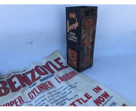 A Benzoyle Upper Cylinder Lubricant wall mounted tin dispenser with a glass jug inside, also a Benzoyle advertising poster.