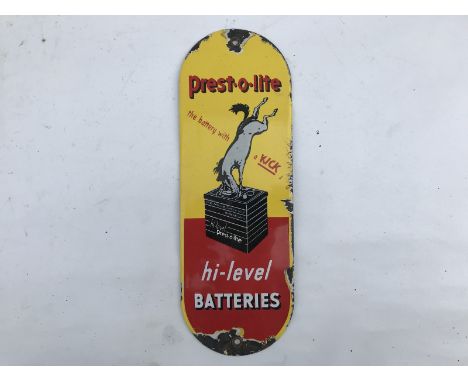 An enamel door fingerplate advertising Prest-O-Lite High Level Batteries, with a central image of a battery and a kicking hor