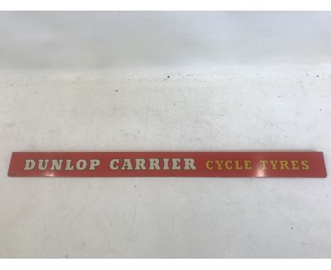 A Dunlop Carrier Cycle Tyres shelf strip, in very good condition.