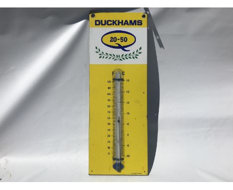 A Duckhams 20-50 enamel thermometer by Burnham with damaged tube, 13 x 36". 