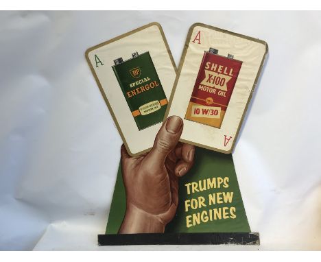 A rare and unusual BP Energol and Shell X-100 die-cut shaped pictorial showcard depicting a hand holding two playing cards de