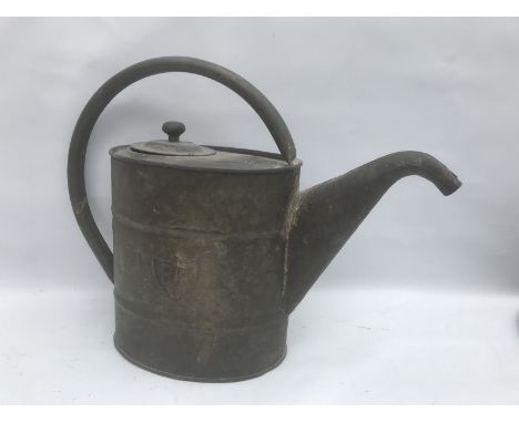An unusual BP oval watering can, with embosssed BP logo to both sides. 