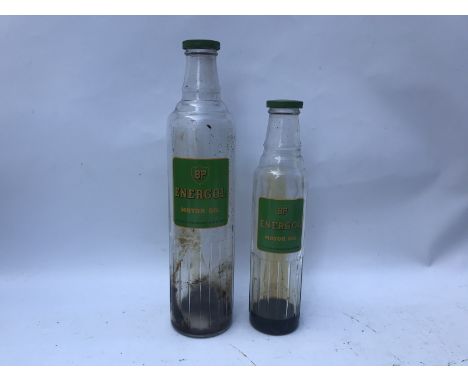 A BP Energol Motor Oil quart oil bottle and a similar pint example, both with correct lids.