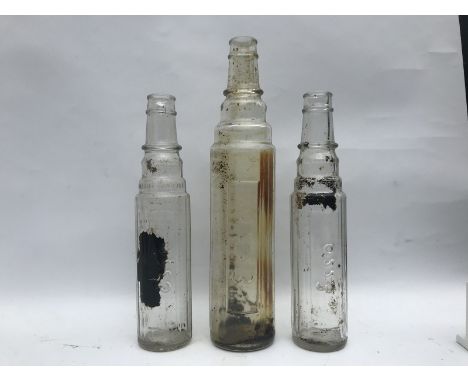 Three Esso oil bottles. 