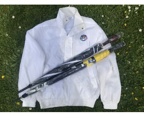 An Esso 'Tiger in your tank' promotional jacket and two promotional umbrellas. 