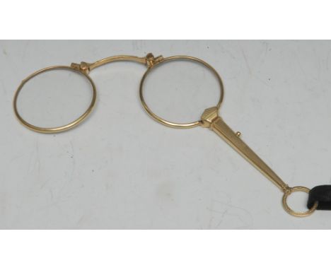 A pair of late 19th/early 20th century lady's gold-plate lorgnettes, of typical form, engine-turned throughout, 11.5cm long, 